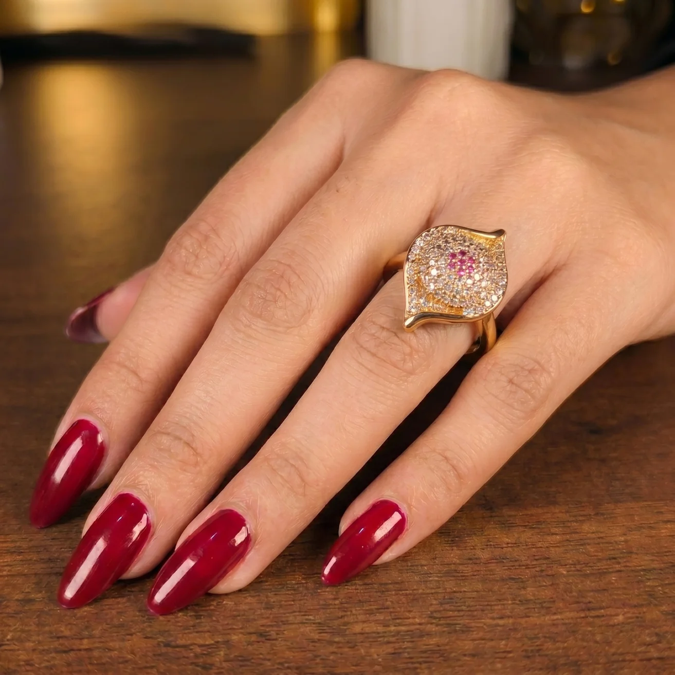 Sculptural wave with a pink center stone ring
