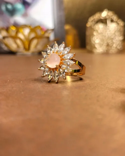 Floral sunburst ring with pink stone
