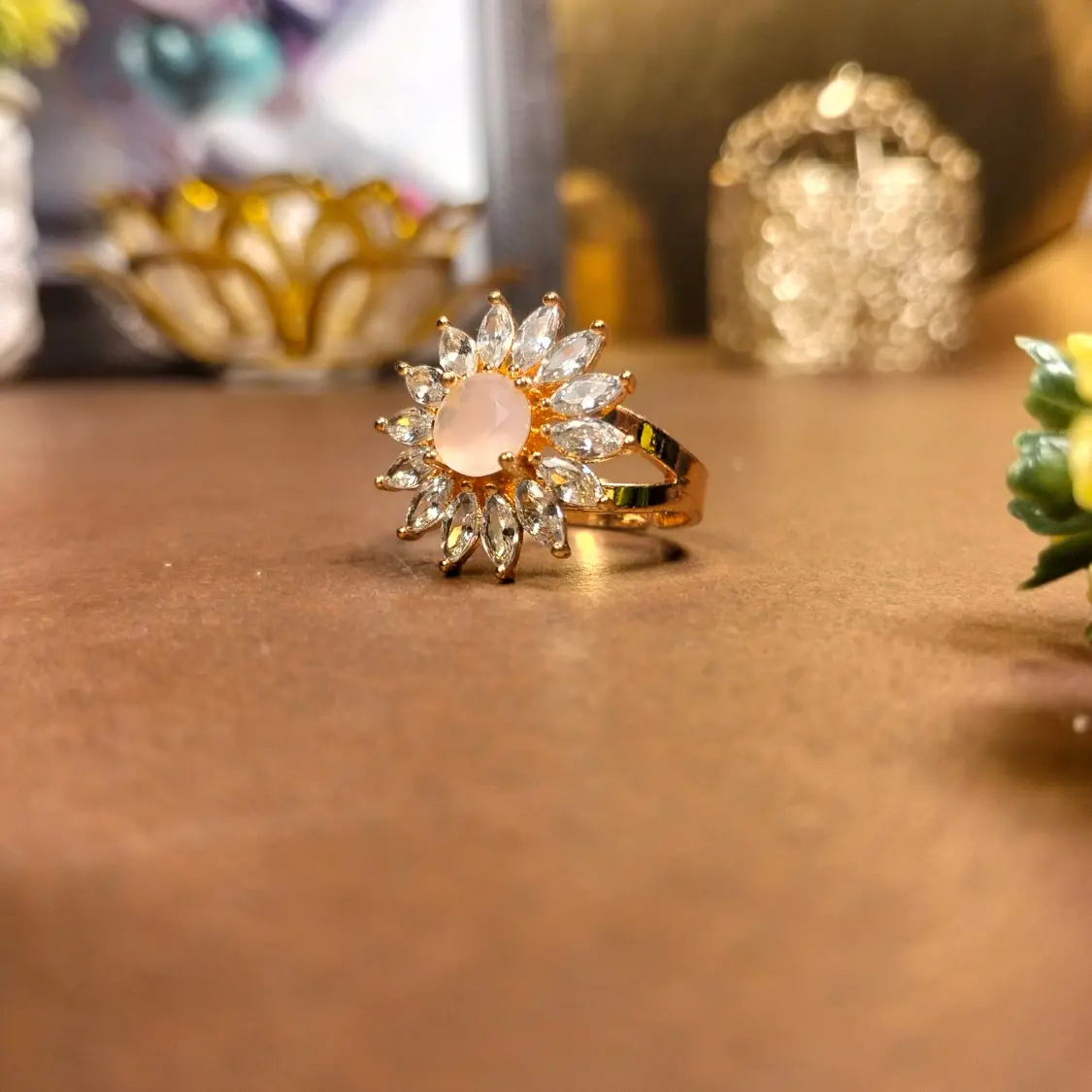 Floral sunburst ring with pink stone